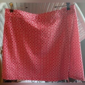 RipSkirt Hawaii Quick Wrap Skirt in a red and white geometric "dot" print.